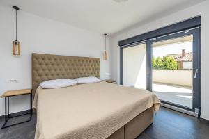 Postel nebo postele na pokoji v ubytování Villa PHOENIX