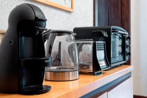 a coffee maker sitting on top of a counter at Appartamento Pineta in Chiesa in Valmalenco
