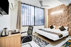 Postel nebo postele na pokoji v ubytování Kings Court Hotel Pitampura