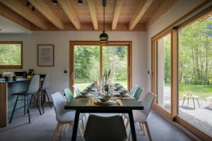 a dining room with a table and chairs at Chalet Ormiages - OVO Network in Saint-Gervais-les-Bains +16 photos