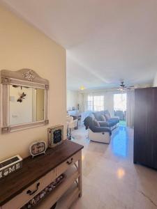 a living room with a couch and a table at Paraiso en Palmmar in Palm-mar