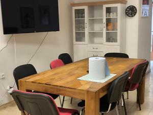 a conference room with a wooden table and chairs at Lydiana Ubytování in Vysoké Mýto