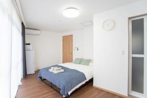 Ένα ή περισσότερα κρεβάτια σε δωμάτιο στο Natsumiホテル 高级独栋别墅301