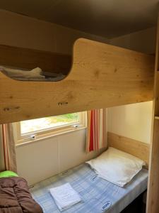 Postel nebo postele na pokoji v ubytování camping de la mottelette