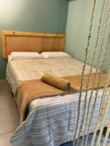 En eller flere senge i et værelse på Estação verão