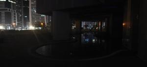 a dark photo of a city at night at JLT 1BR Marina Skyline View in Dubai
