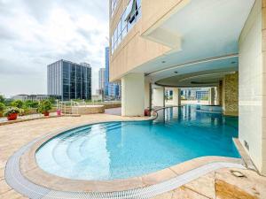 a swimming pool in the middle of a building at JLT 1BR Marina Skyline View in Dubai