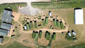 an aerial view of a farm with buildings at 3 Buzzard Rest, Camp Tapnell in Yarmouth