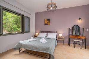 En eller flere senge i et værelse på Casa Mare2