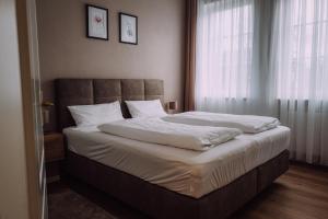 Postel nebo postele na pokoji v ubytování Europa Residenz Bad Füssing