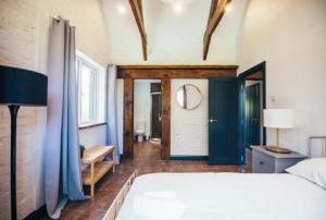 a bedroom with a large bed in a room at Waters Edge Spa in Carryduff