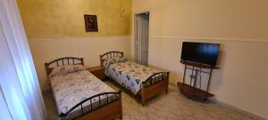 A bed or beds in a room at Dimora San Gabriele
