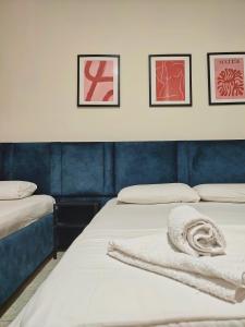 Postel nebo postele na pokoji v ubytování Duka Rooms