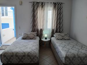 Posteľ alebo postele v izbe v ubytovaní Artemis Bakerys House 2