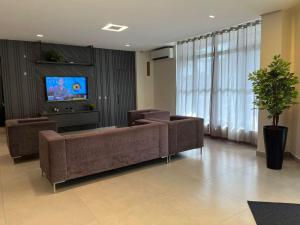 TV a/nebo společenská místnost v ubytování Moura Palace Hotel
