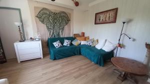 a living room with a couch with pillows on it at La cacarinette in Rayol-Canadel-sur-Mer