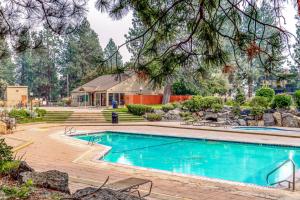 a swimming pool in a yard with a house at Night at the Inn in Bend
