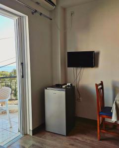 TV a/nebo společenská místnost v ubytování Duka Rooms