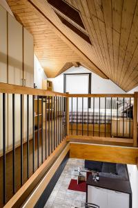 a room with a balcony with a wooden ceiling at Faber Apartments-Residence Style in Arona
