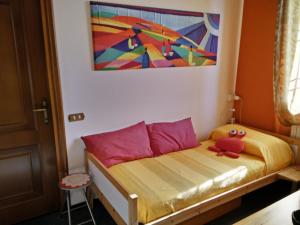 A bed or beds in a room at Le Magnolie B&B