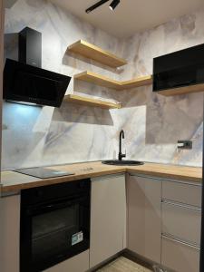 Kuchyň nebo kuchyňský kout v ubytování Apartments Duje