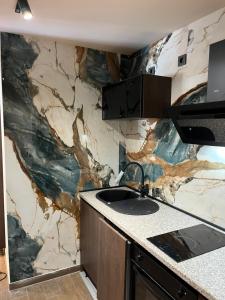 Kuchyň nebo kuchyňský kout v ubytování Apartments Duje