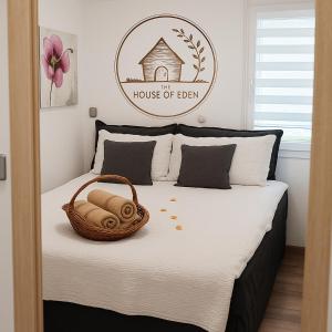 a bedroom with a bed with a basket on it at Cozy Family Stay in Terme Čatež - Free Tickets and Thoughtful Touches in Čatež ob Savi