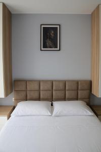 Postel nebo postele na pokoji v ubytování AMMEN Apartment