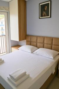 Postel nebo postele na pokoji v ubytování AMMEN Apartment