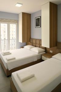 Postel nebo postele na pokoji v ubytování AMMEN Apartment