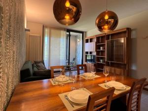 a dining room with a table with wine glasses at La Libellula - [Parcheggio gratuito] in Alba