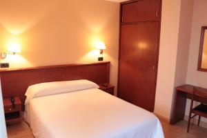 Posteľ alebo postele v izbe v ubytovaní Hotel Maycar
