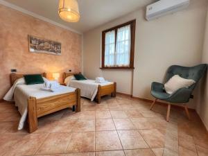Ένα ή περισσότερα κρεβάτια σε δωμάτιο στο Casa degli Ulivi