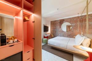Postel nebo postele na pokoji v ubytování Hotel Milu Milano