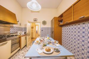 a kitchen with a table with food on it at CasAdòro in Arezzo