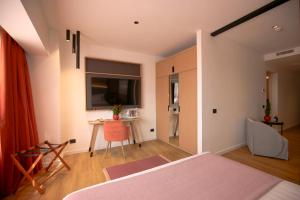 TV o dispositivi per l'intrattenimento presso Hotel Poseidon