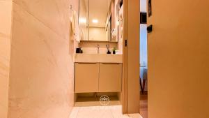 a small bathroom with a sink and a counter at Flat FM20 Cabo Branco Piscina Privativa - By Almare in João Pessoa +29 photos