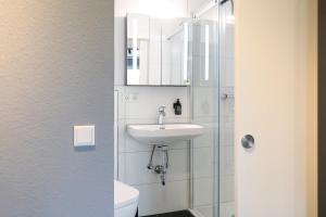 Koupelna v ubytování Harzbeat + 44 fotografií