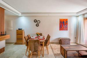 a dining room with a table and chairs at Appartement de prestige Gueliz kasbel 212 in Marrakech