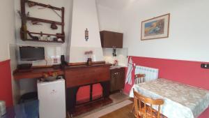 a kitchen with a table and a table and a room at Tana Libera Tutti 1 Nature, Yourself, Love in Viggianello