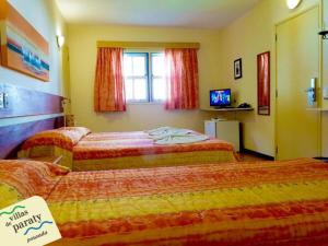 Postel nebo postele na pokoji v ubytování Villas De Paraty