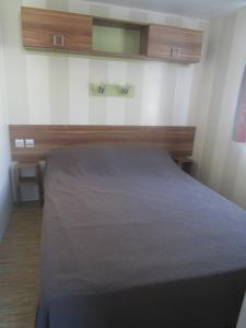 Ένα ή περισσότερα κρεβάτια σε δωμάτιο στο Mobil-home