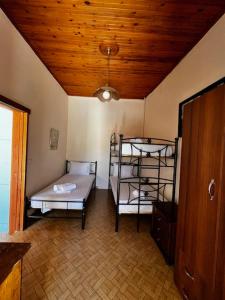 Postel nebo postele na pokoji v ubytování Voitylon