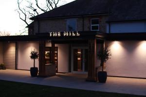 a brick building with a sign that reads the wills at The Mill Sharnbrook - Bedford in Sharnbrook