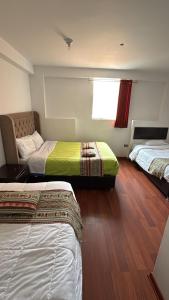Postel nebo postele na pokoji v ubytování Alegria s House Cusco