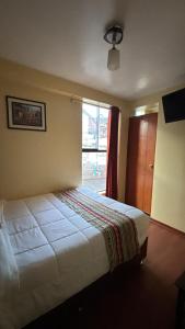 Voodi või voodid majutusasutuse Alegria s House Cusco toas