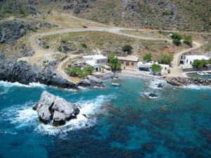 an aerial view of a small island in the water at Mythos Apartments in Damnoni