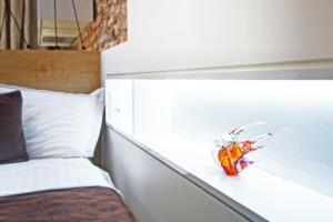 Cama ou camas em um quarto em Angel Wing Apartamentai