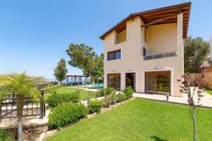 A garden outside Villa St Nicholas by Villa Plus