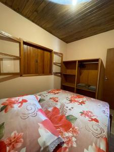 Ein Bett oder Betten in einem Zimmer der Unterkunft Pousada Sonho Meu